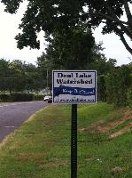 One of 22 signs throughout all seven towns bordering Deal Lake, this Eagle Scout project was designed by Erik Brockel