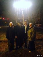 Menorah lighting on the final night of Hanukkah, with Rabbi Carlebach